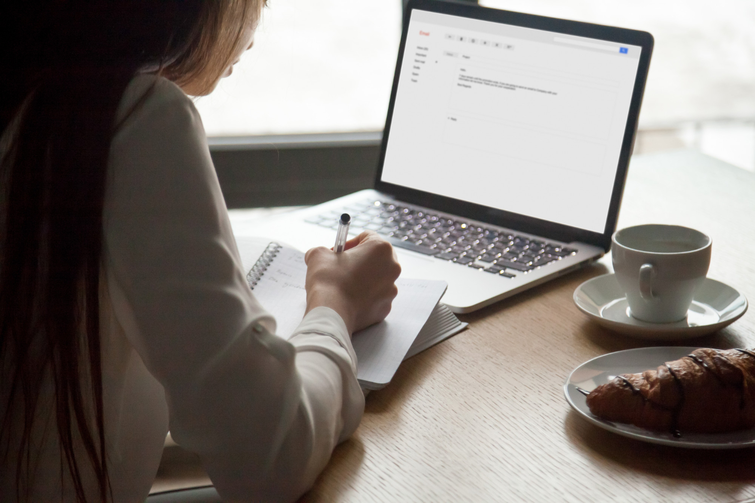 Woman Making Notes Reading Email Letter